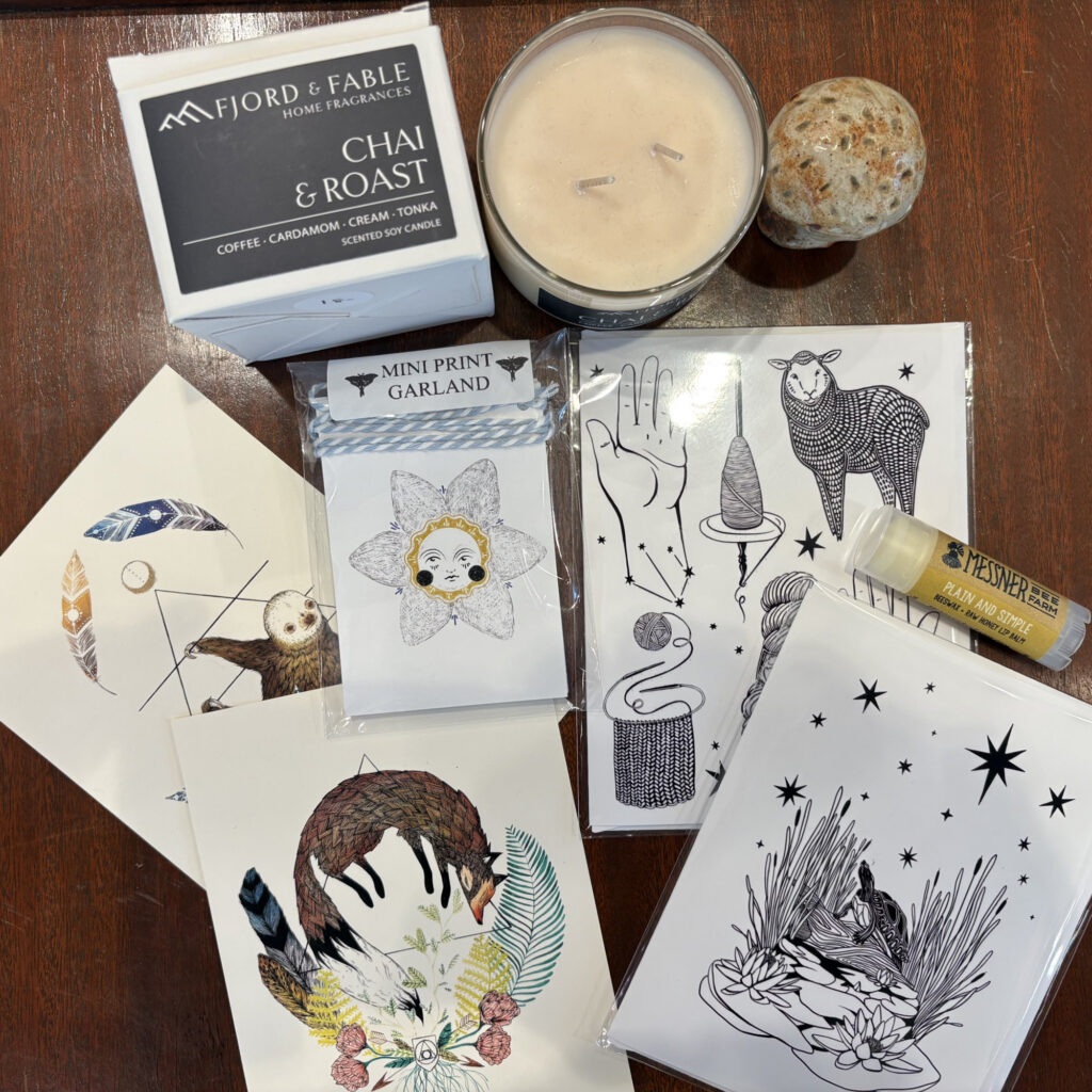 Marika Paz postcards and Fjord & Fable candles on table